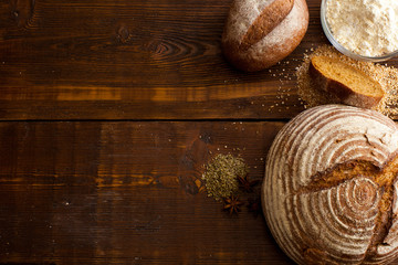 Canvas Print - Brown bread on the wooden table