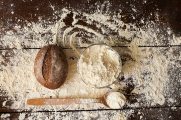 Canvas Print - Bread and flour on the table