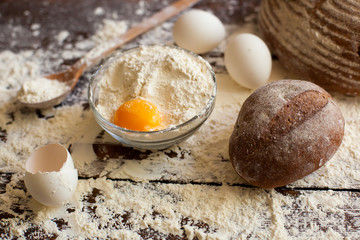 Wall Mural - Bowl of flour with eggs and bread