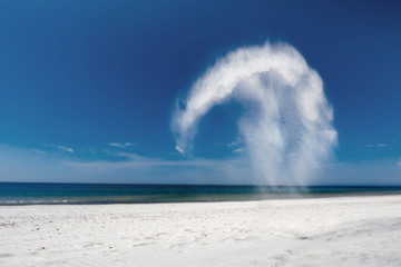  Flying white sand on the beach