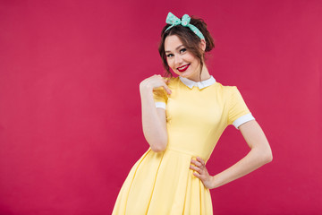 Canvas Print - Smiling beautiful young woman in yellow dress