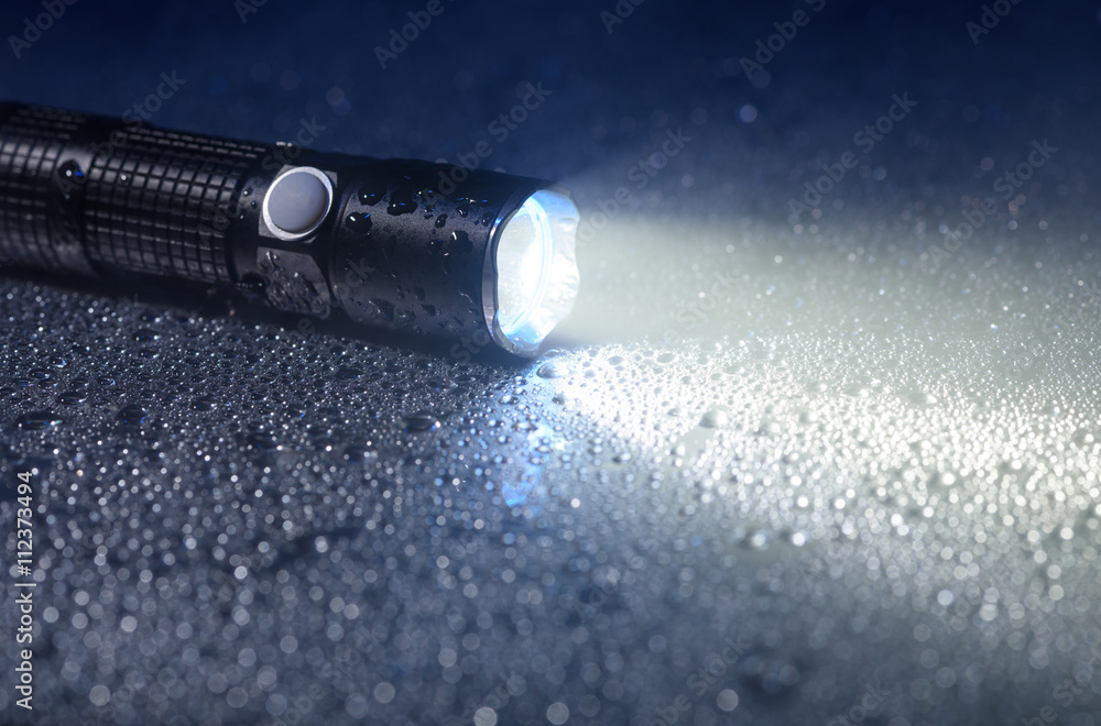 Tactical waterproof flashlight - obrazy, fototapety, plakaty 