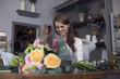 © Picxel Creative - Female Florist Working On Bouquet In Shop