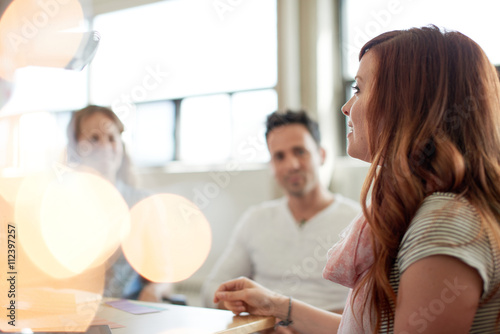 Fotomural Unposed group of creative business people in an open concept office brainstorming their next project