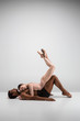 © master1305 - Couple of ballet dancers posing over gray background