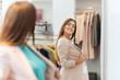 © Syda Productions - happy woman posing at mirror in clothing store