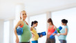 © Syda Productions - happy pregnant woman with ball in gym