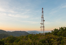 Communication Tower Antenna On Mountain At Twilight