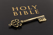 Holy bible and vintage key on cover concept theology study