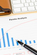 Pareto principle business analysis planning with pen, and keyboa