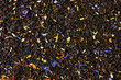 © san_ta - Dry tea with fruit and flower petals as background