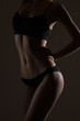 © Alexander Molofeev - silhouette of slim woman body in black low key