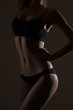 © Alexander Molofeev - silhouette of slim woman body in black low key