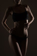 © Alexander Molofeev - silhouette of slim woman body in black low key