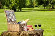 Wicker picnic hamper with wine and bread