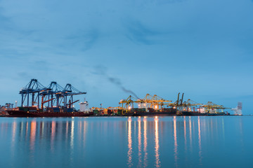 Container Cargo freight ship by crane bridge