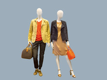 Two Mannequins Dressed In Casual Clothes.