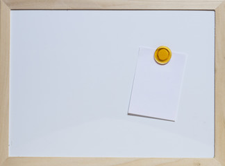 paper note with magnet on whiteboard. Blank paper and a blank area for text input