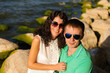 © Nadya Kolobova - Young lovers on the rocks by the sea and enjoy each other