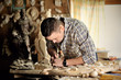 carver working in his workshop