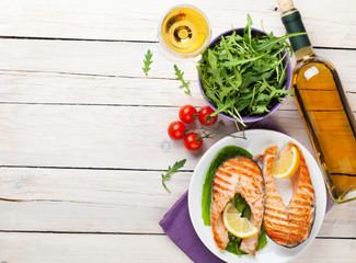 Sticker - Grilled salmon and white wine on wooden table