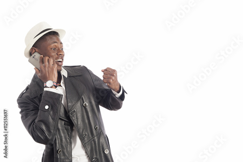 Young african american man using a mobile phone Poster