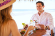 © AntonioDiaz - Young couple eating lunch at the beach