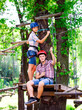 © davit85 - adventure climbing high wire park - people on course in mountain