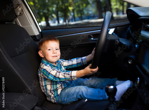 little boy driving