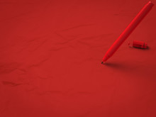 Red Pen On Red Background