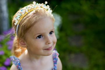 beautiful girl in a summer garden, children's holidays