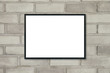 © tirachard - Mock up blank poster picture frame on brick wall.