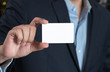 © praphab144 - Business man handing a blank business card