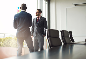 Canvas Print - Two businessmen standing talking together