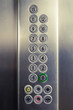 Different buttons in modern metal elevator   