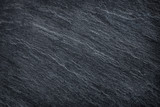 Fototapeta Desenie - Dark grey / black slate stone background or texture.