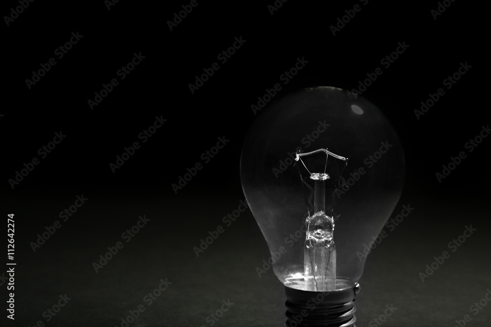 Electric bulbs on dark grey background