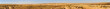 Wide panorama of mountains in Negev desert with road