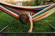 © Breanna Peterson - Young girl in hammock, leaning out
