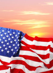 Wall Mural - Flag of United States of America on sunset background