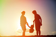 © nadezhda1906 - happy family including pregnant mother, father and toddler at sunset