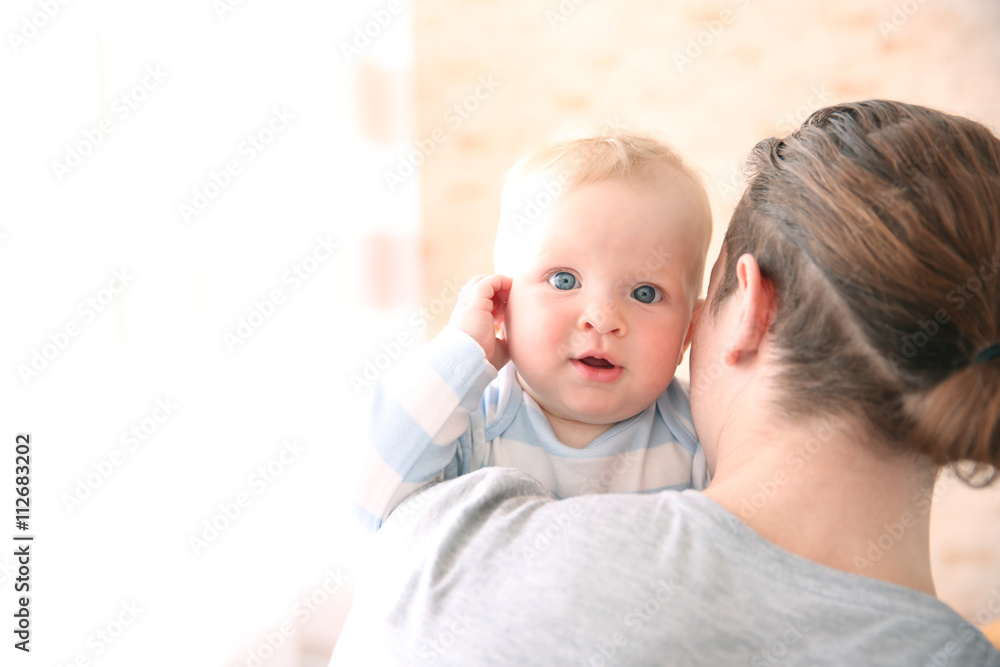 Young father having fun with his little son