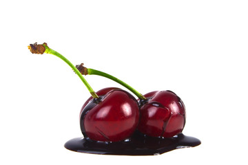 Cherries in chocolate on a white background