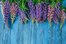 Fresh Lupines Arranged On Old Wooden Background With Copy Space