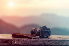 Travel Photographer Equipment With Beautiful Landscape On The Ba
