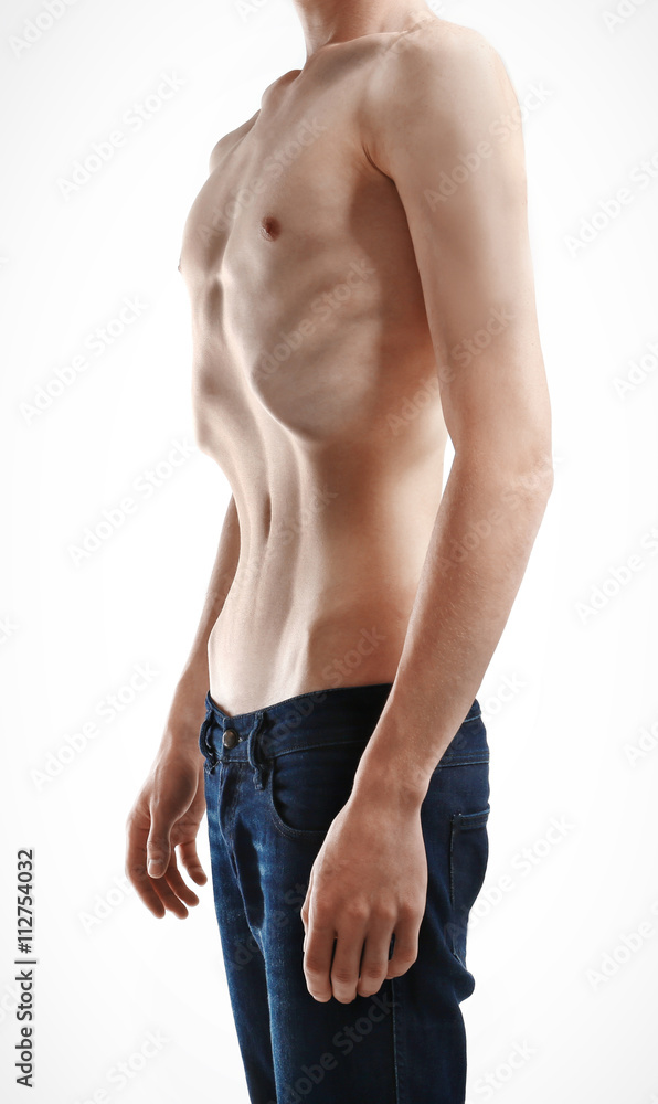 Skinny young man with anorexia on white background