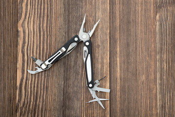 Multitool on wooden surface