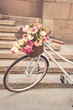  vintage girls bicyclewith flowers in basket