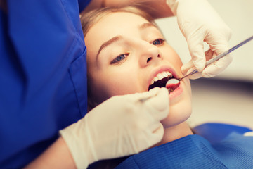 Sticker - female dentist checking patient girl teeth