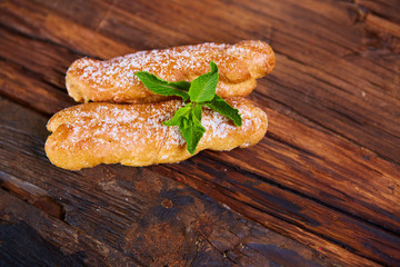 Two eclair decorated with mint